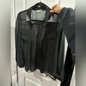 Black blouse with gem embroidery at collar